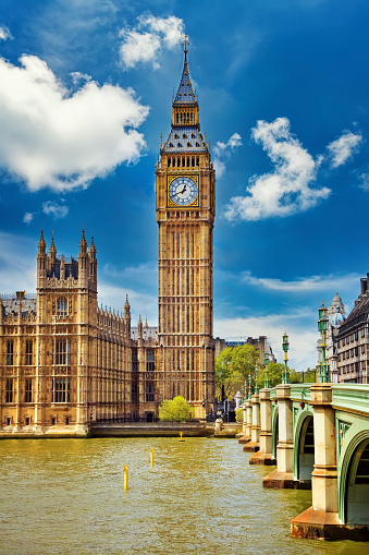 The Big Ben, the House of Parliament and the Westminster Bridge at night, London, UK.