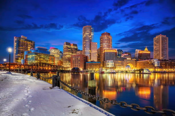 istock Boston skyline, financial district and harbor at winter night 1453374509