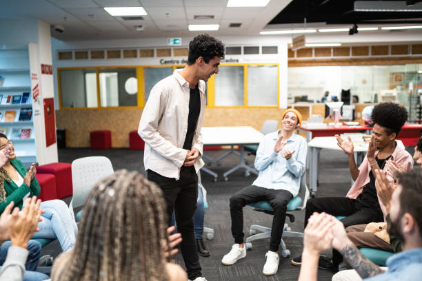 istock Young university student man lecturing to students at university 1453374555