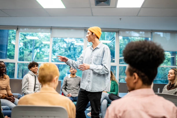 istock Young university student man lecturing to students at university 1453374574