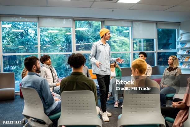 Lecturing Boy Young University Student Man Lecturing To Students At University Stock ...