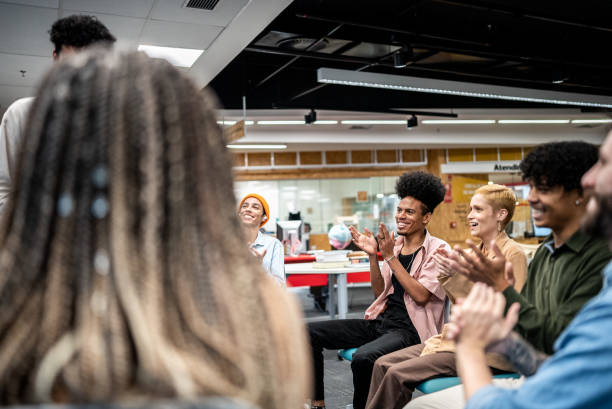 istock University students applauding a presentation at the university 1453374619