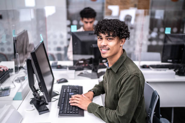 istock Portrait of university student working on computer in the library at campus 1453375623