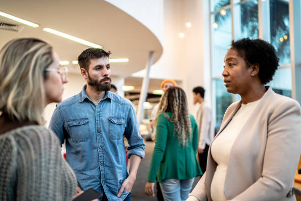 istock Mature teacher talking to university students at university or a business conference 1453377121