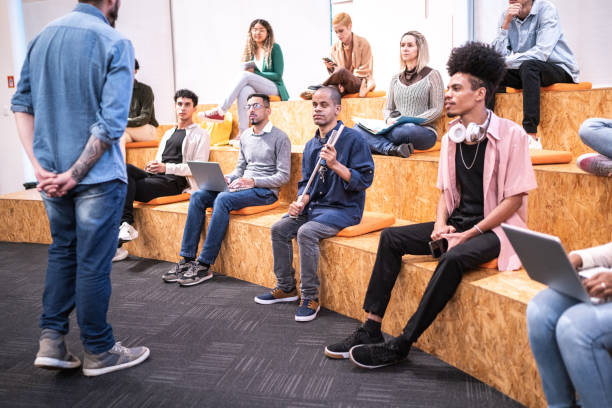 istock University students or business people watching a lecture at auditorium 1453378059