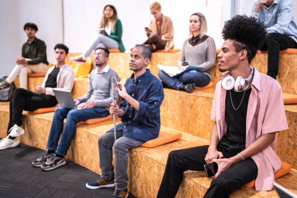 istock University students or business people watching a lecture at auditorium 1453378060