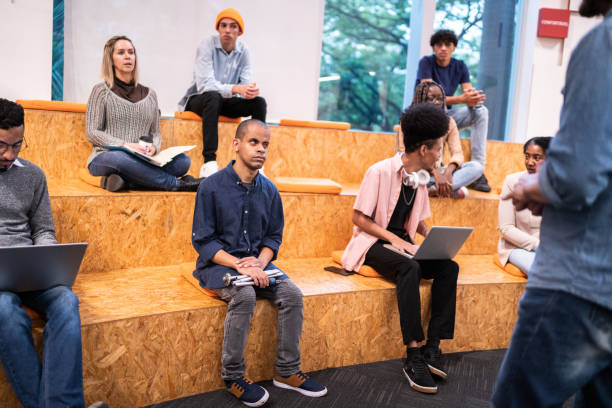 istock University students or business people watching a lecture at auditorium 1453378073