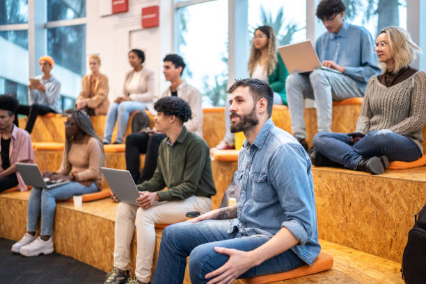 istock University students or business people watching a lecture at auditorium 1453378105