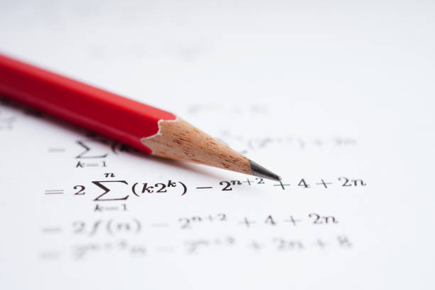 istock Pencil on mathematic formula exercise test paper in education school. 1453381834