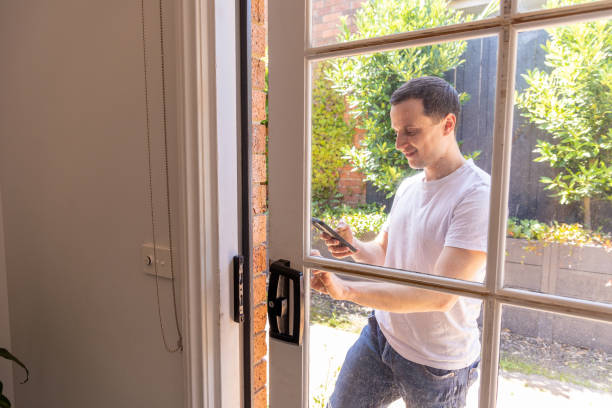 istock Happy man at home using wireless technology, he uses phone 1453382182