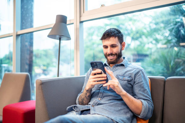 istock Mid adult man using the mobile phone 1453382217