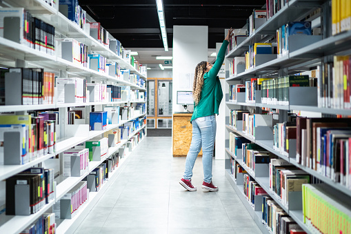 Bookcases on the aisle of the library in the University of Fujian Province, China