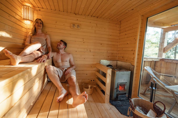 istock Young Couple Relaxing In Finnish Sauna 1453388413