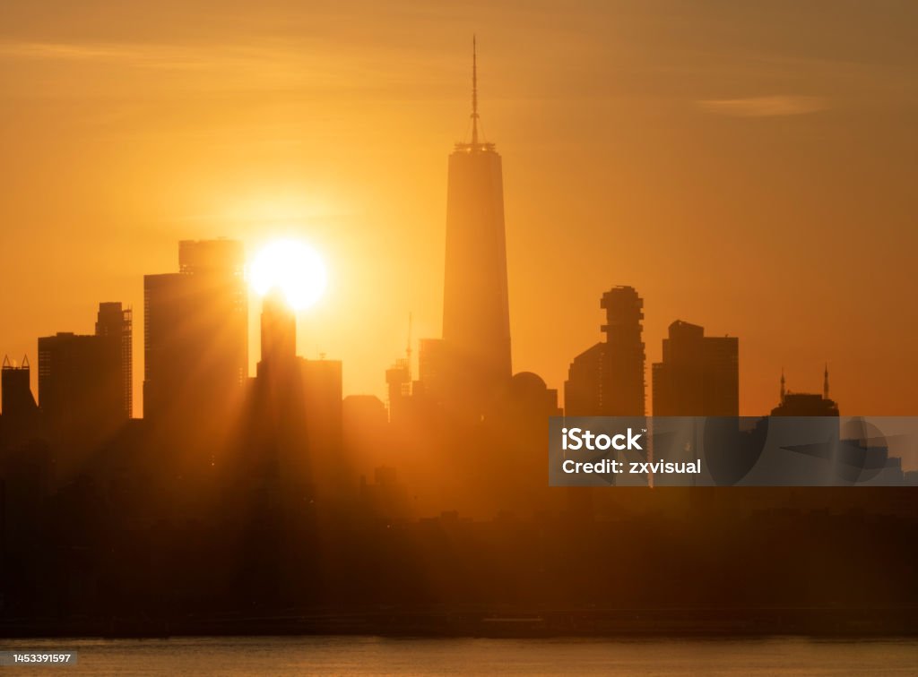 Manhattan Skyline Sunset Sun setting behind the Manhattan skyline. New York City Stock Photo