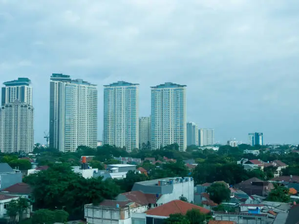 A tall building located in a densely populated city