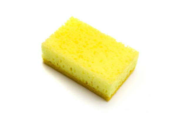 istock Single yellow sponge isolated on white background 1453393195
