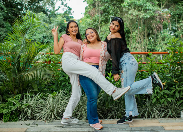 istock Young women sharing smiling and playing. 1453393862