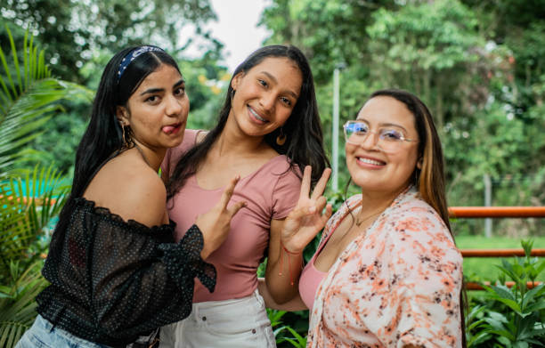 istock Young women sharing smiling and playing. 1453393868