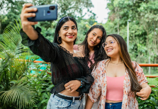 istock Young women sharing smiling and playing. 1453393888