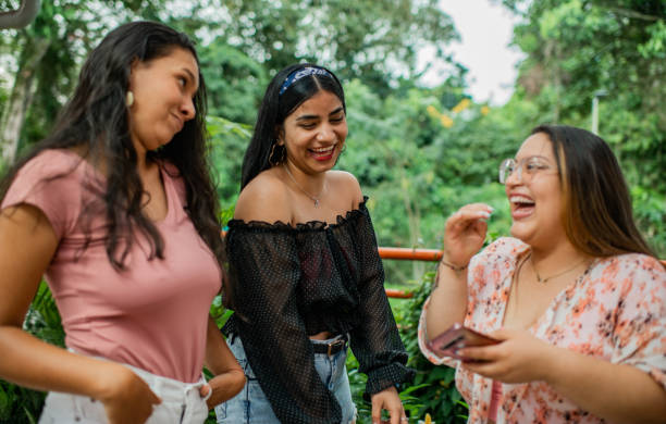 istock Young women sharing smiling and playing. 1453393892