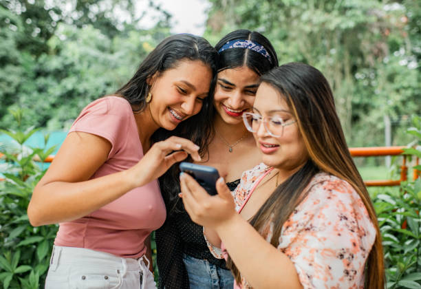 istock Young women sharing smiling and playing. 1453393893