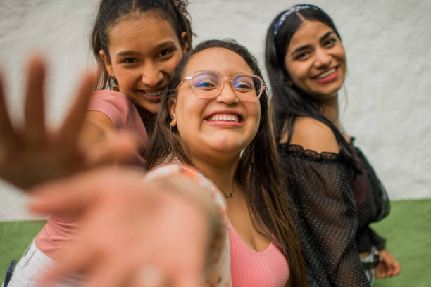 istock Young women sharing smiling and playing. 1453394018