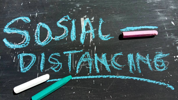 istock Social Distancing text on a black and crayon background 1453406508