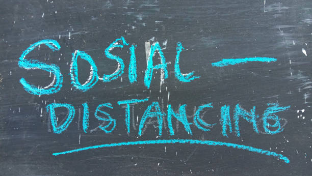 istock Social Distancing text on a black and crayon background 1453406538