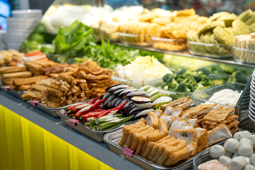 Penang street food stall with various choices of vegetables, fish ball, bean curd and tofu filled with ground meat mixture or fish paste.