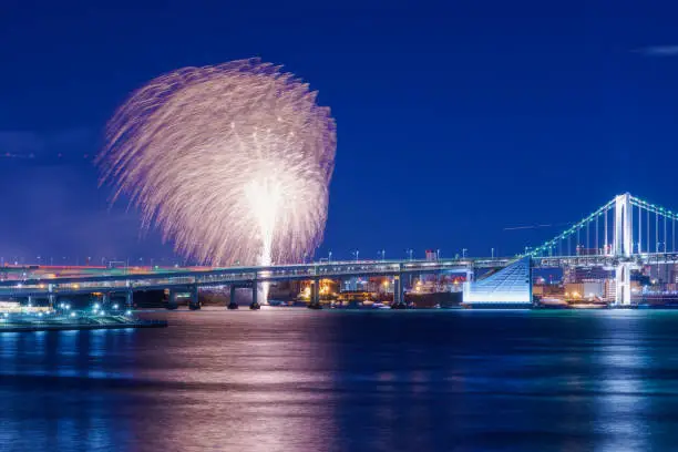 View of Rainbow-Bridge and ”Odaiba Rainbow Fireworks” from Toyosu-ohashi bridge, Tokyo, Japan