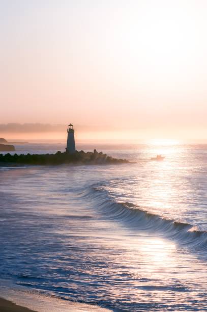 istock Vertical shot of a lighthouse overlooking a beautiful ocean during the sunset 1453422870