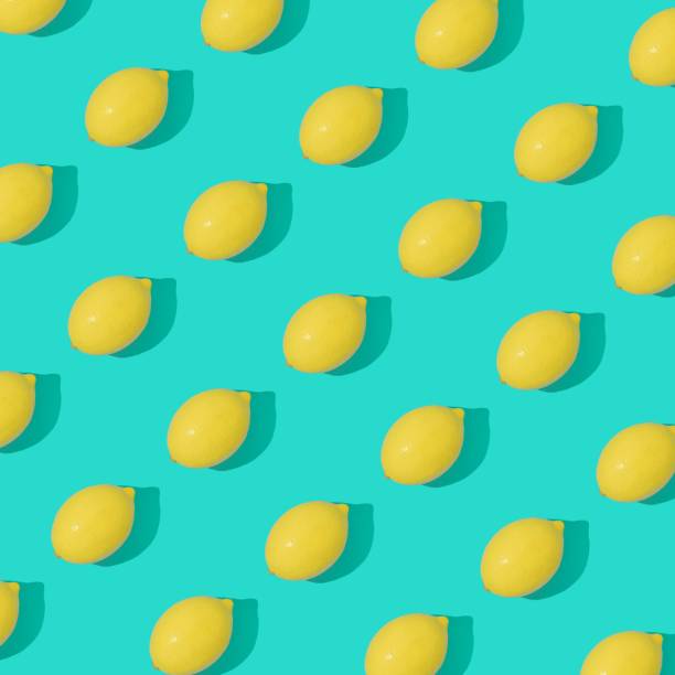 3D yellow lemon pattern on pastel blue background - summer concept