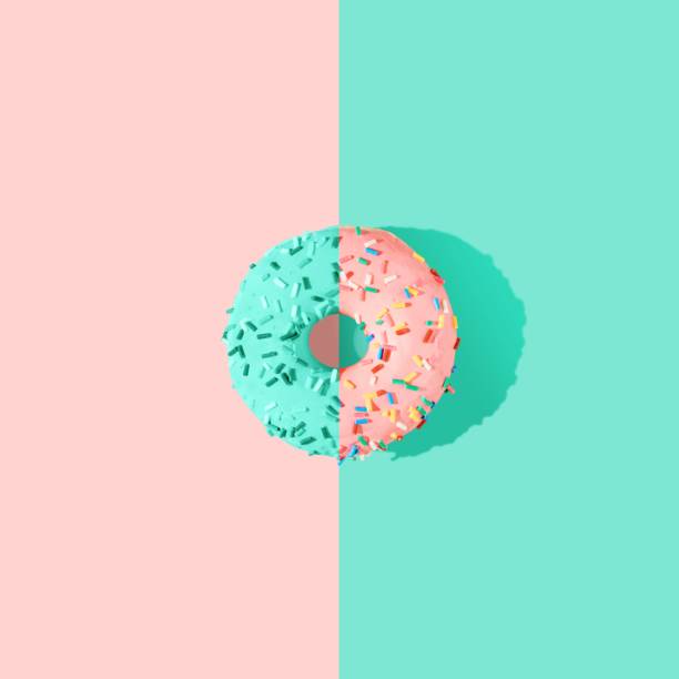 istock 3D rendered pink and blue glazed donut on the bright blue background 1453424671