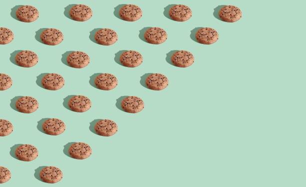 istock 3D rendered chocolate chip cookies on the blue background with copy space 1453424690
