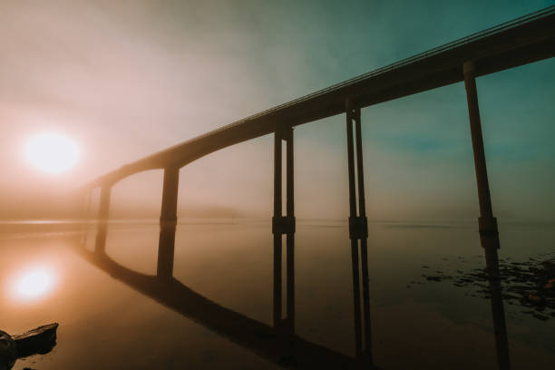istock Bridge over the lake at a colorful sunset background 1453428514