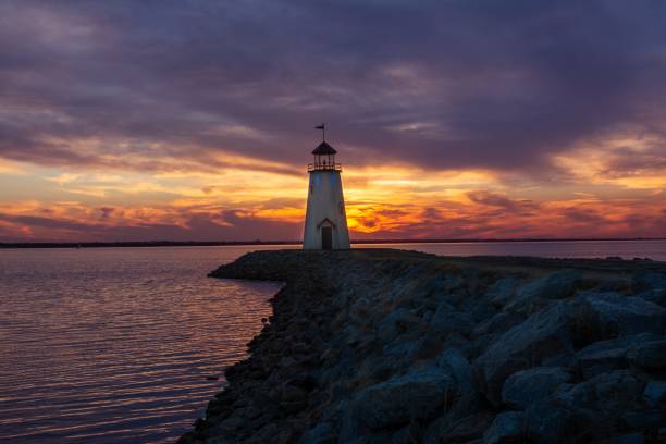 istock Beautiful cloudy sunset sky over an old Hefner lighthouse in Oklahoma, USA 1453428794