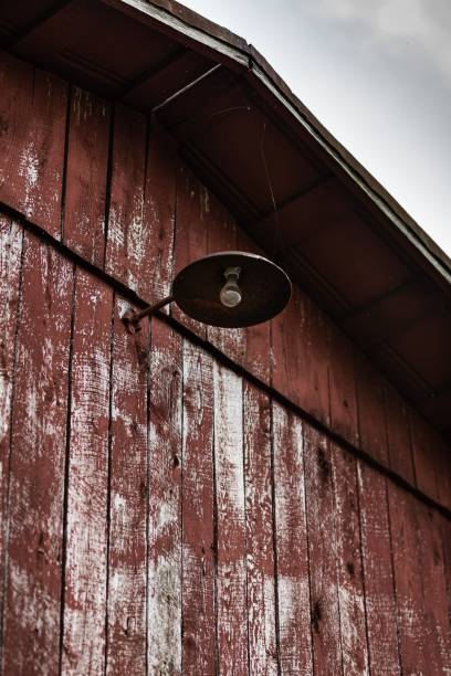 istock An old wooden barn with an old lamp on it 1453429606