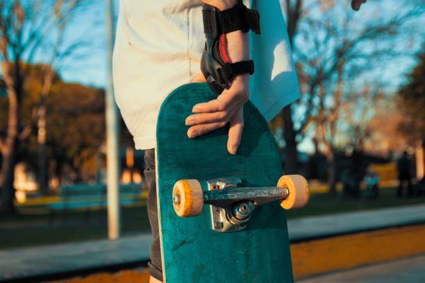 istock Closeup of a skateboard in its owner's hand 1453429762