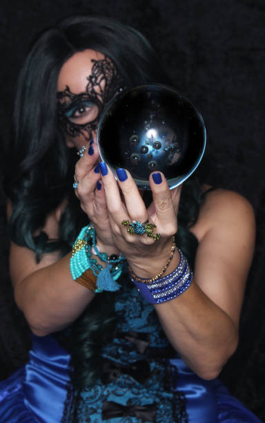 istock Woman in Blue Corset With Crystal Ball 1453430676