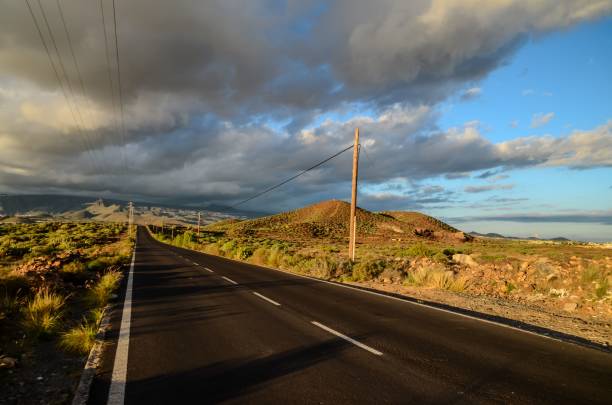 istock Lonely Road in the Desert 1453432588