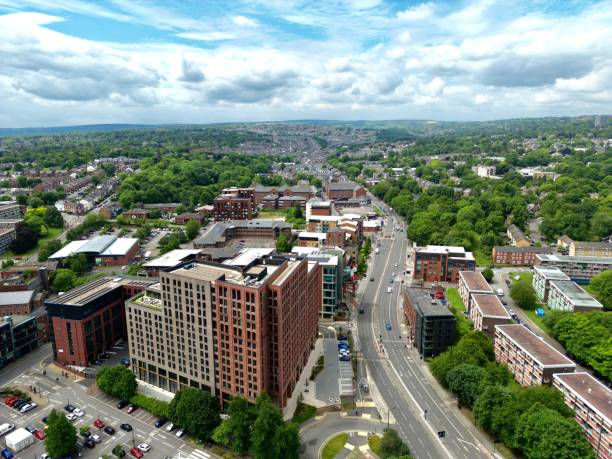 An aerial shot of beautiful Ecclesall Road with green trees and buildings in Sheffield, England