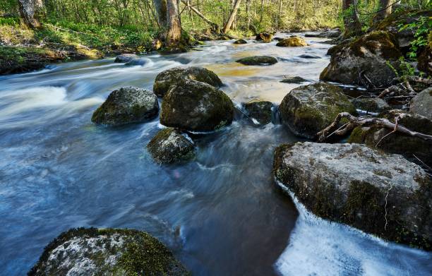 istock A light exposure stream of water over rocks 1453432886