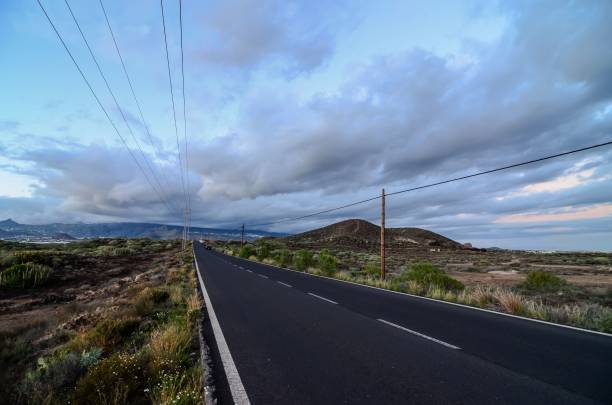 istock Lonely Road in the Desert 1453432888