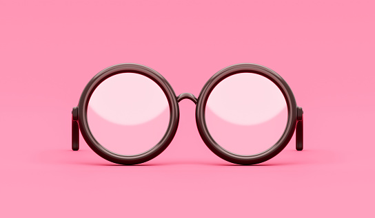 Las gafas de moda 3D negras aisladas sobre un fondo rosa moderno con el concepto clásico de estilo retro o las gafas de sol usan lentes ópticas elegantes hipster de marco redondo y anteojos de estudiante que estudian el equipo escolar. photo