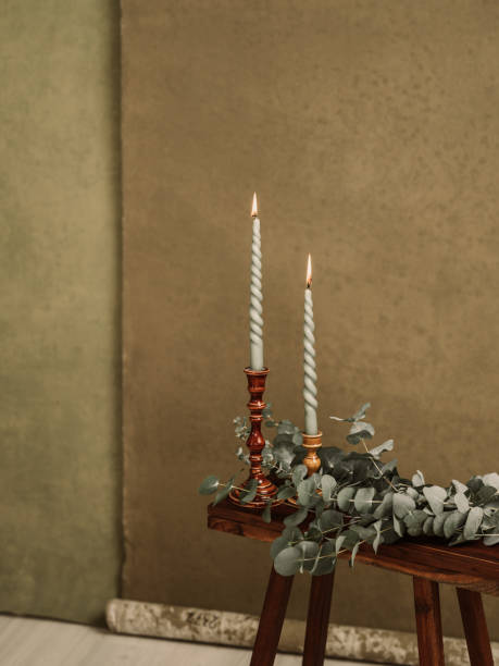 istock Candles and Eucalyptus leafs still life 1453443439