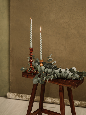 candles and Eucalyptus leafs still life\nPhoto taken in studio