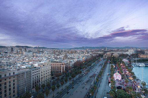Aerial drone like view of Barcelona Port vell marina and Colon avenue. Christmas time.
