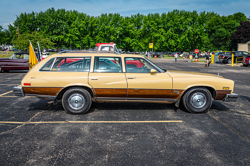 Iola, WI - July 07, 2022: High perspective side view of a 1977 Buick Century Station Wagon at a local car show.