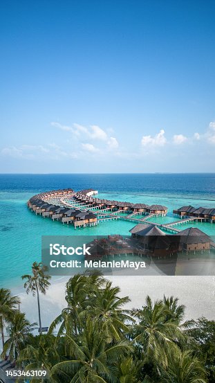 istock Maldives hotel beach resort on tropical Island with aerial drone view 1453463109