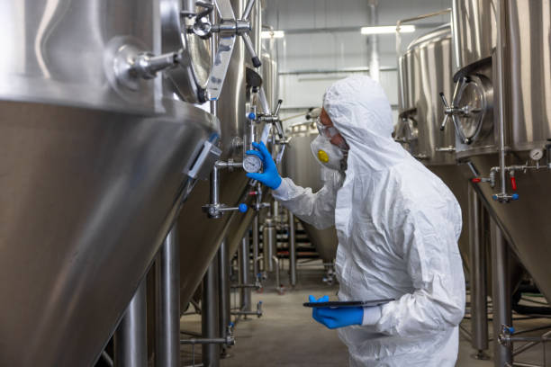 istock Beer tech checking the brewing equipment in the factory 1453463879